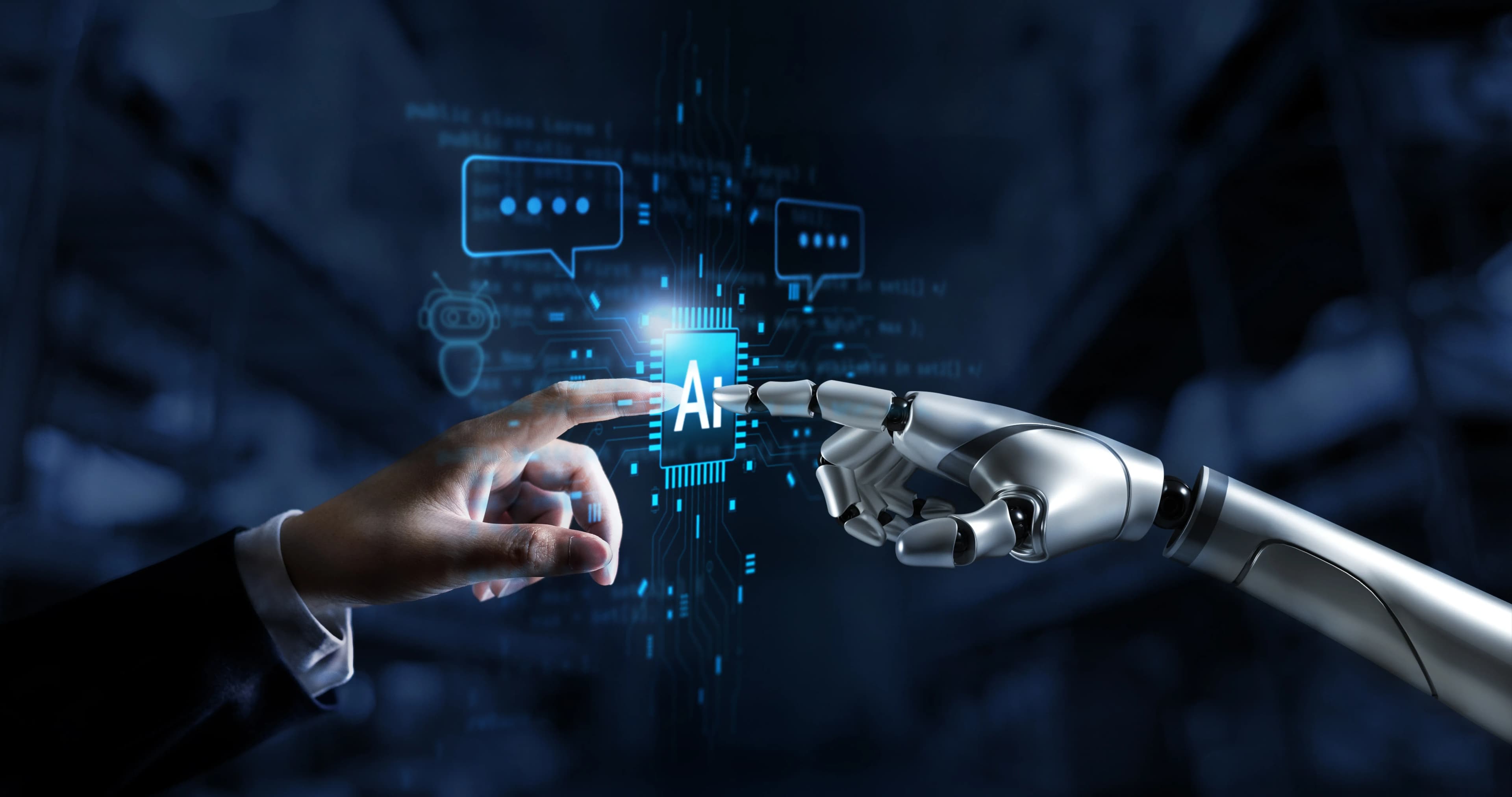 Human and robotic hands beside an AI chip